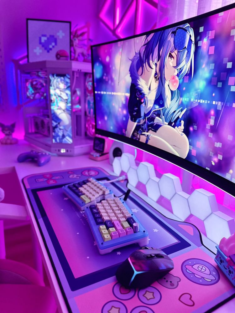 Pink, purple, and blue gaming setup focusing on the monitor, mouse, and keyboard with a Silver Wolf theme.