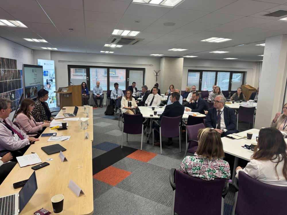A photo capturing the top table and the attendees at the Economic Engagement Forum