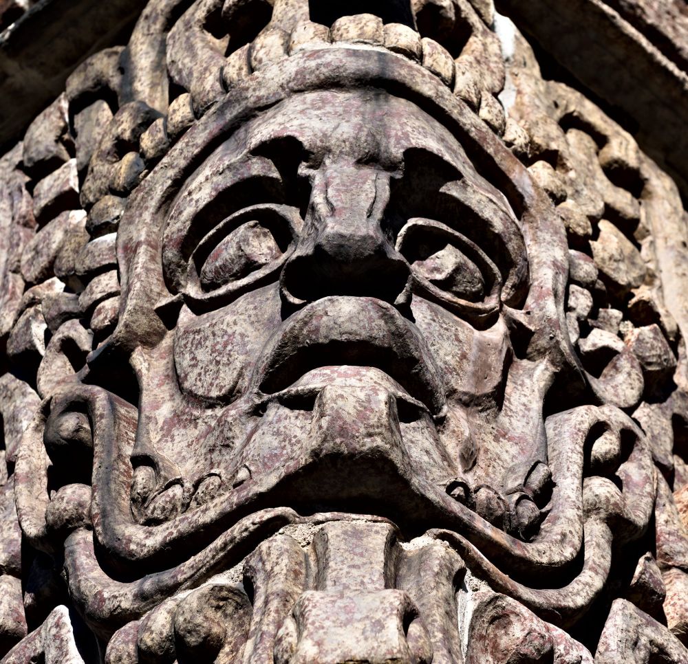 Terra cotta face on the corner of the 1920s Mayan building in Aurora, IL