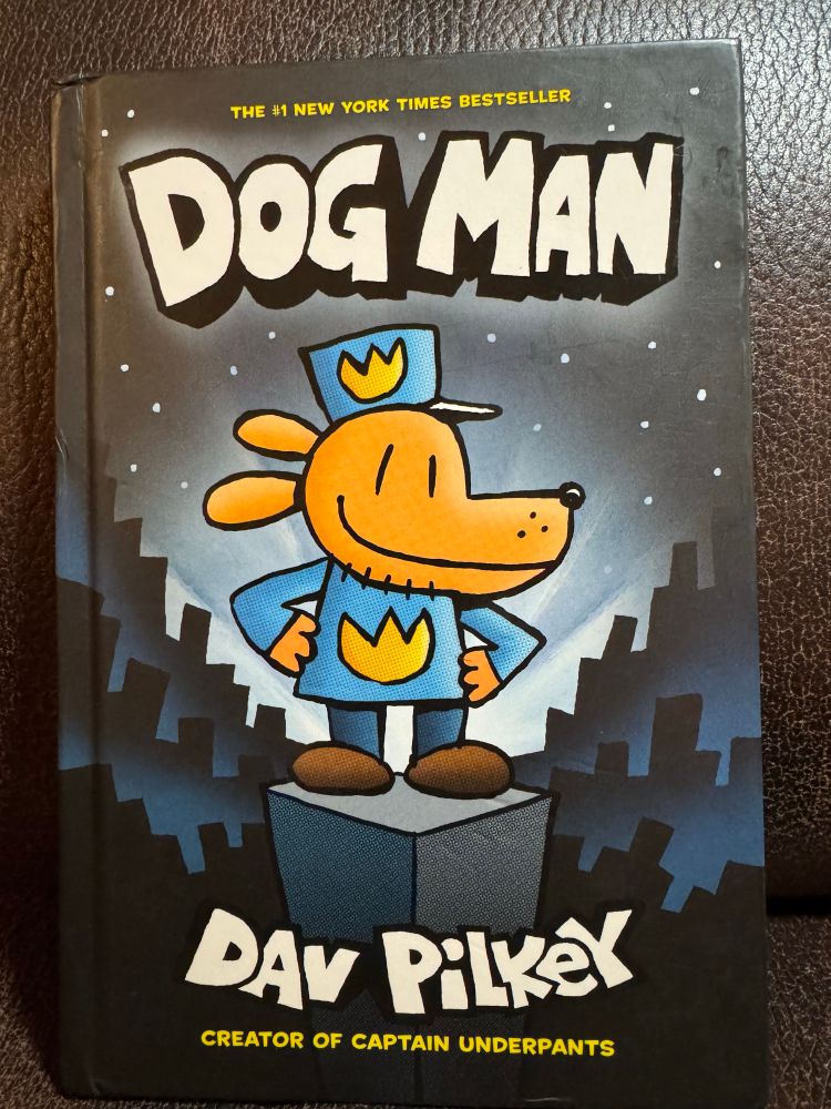 The cover of the graphic novel Dog Man, by Dav Pilkey, which prominently features the titular character.