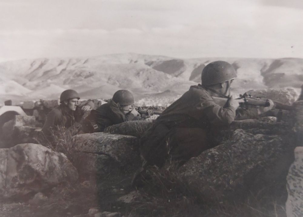 Original wartime caption: Paratroopers line the wall around the top of the Acropolis.