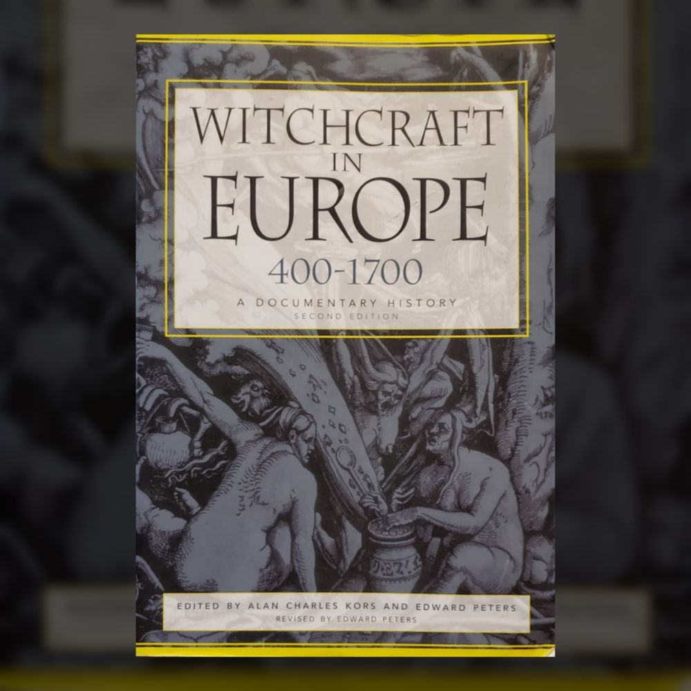 A photo of a softcover book superimpised over a cropped, dimmed, and blurred image of itself, to provide a square frame. 
The book is "Witchcraft in Europe, 400-1700, A Documentary History, Second Edition," edited by Alan Charles Kors and Edward Peters, revised by Edward Peters.
The cover art is a black and white illustration of a chaotic scene featuring naked witches, perhaps a sabbath.