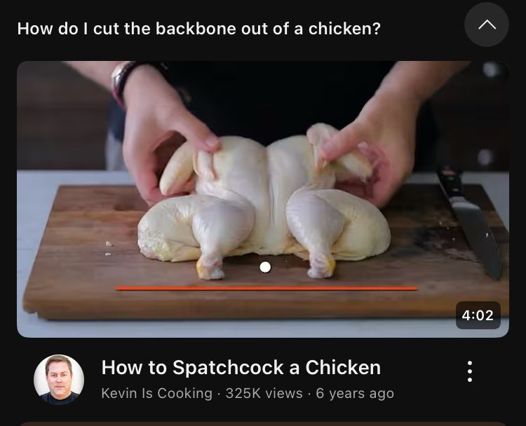Image of a youtube video answering the question “how to cut the spine out of a chicken?” with a video called “how to spatchcock a chicken.” The thumbnail shows a man holding a chicken carcass that has had the spine cut out of it and he is about the flatten the breasts and break the ribs. 