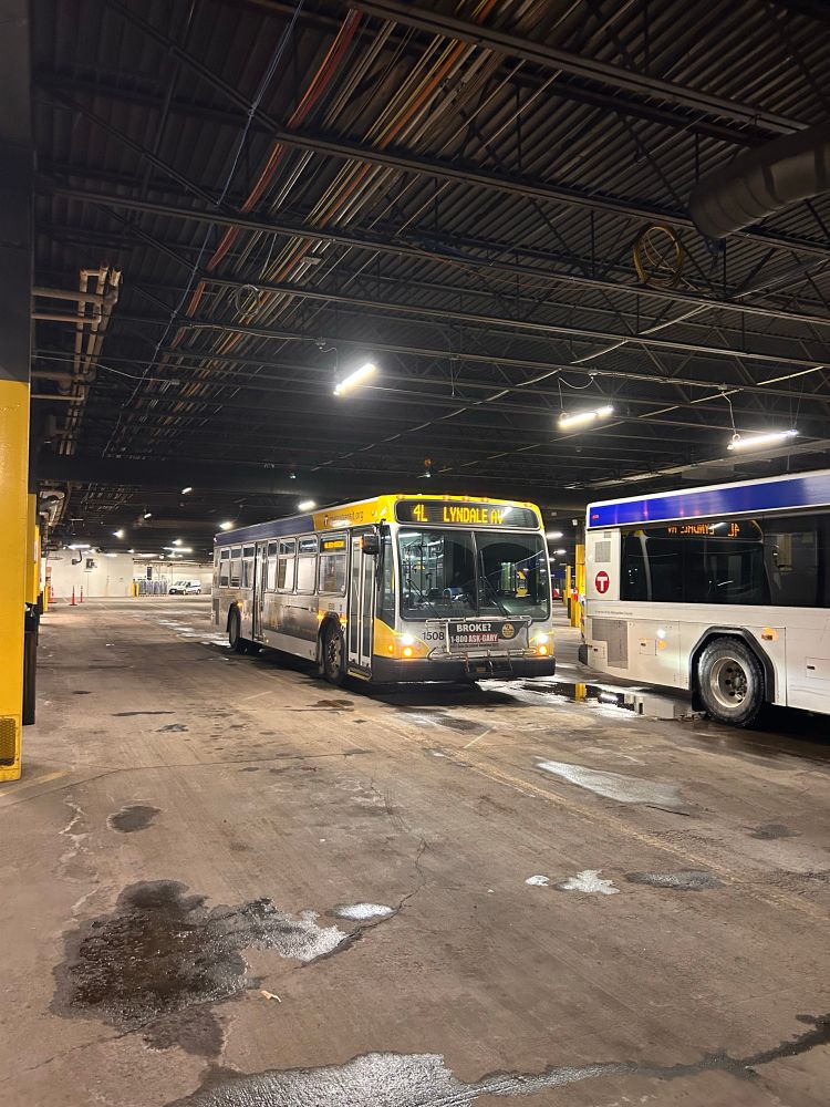 Route 4 bus sitting in a garage getting ready for departure
