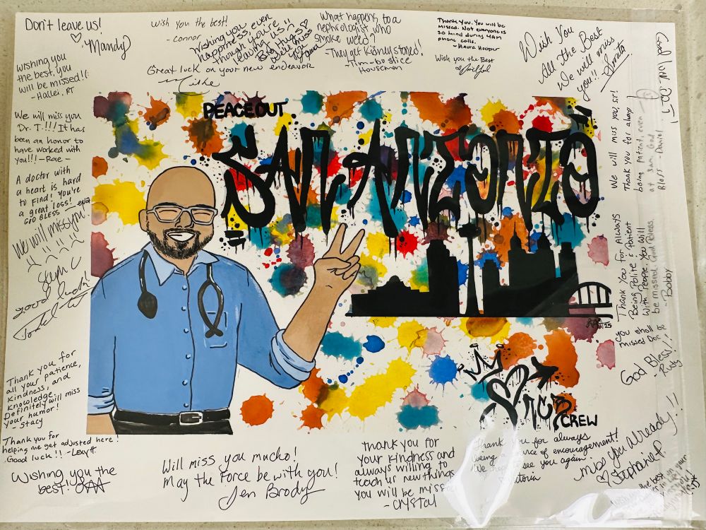Photo of a piece of art, a card with a painting of me giving a peace sign while smiling, with a silhouette of the San Antonio skyline in the background, and the words “Peace Out San Antonio, NCB Crew” in a graffiti style.