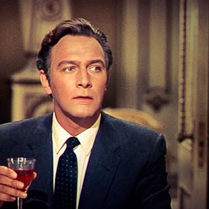 Captain von Trapp wearing a dark suit and tie for dinner mere minutes earlier