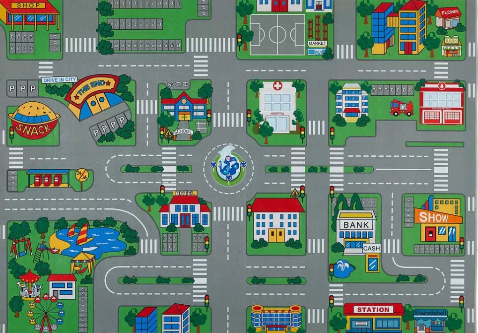 Foto eines Kinderteppichs, auf dem eine Stadt mit vielen Straßen zu sehen ist. Darauf spielt es sich gut mit Spielzeugautos.