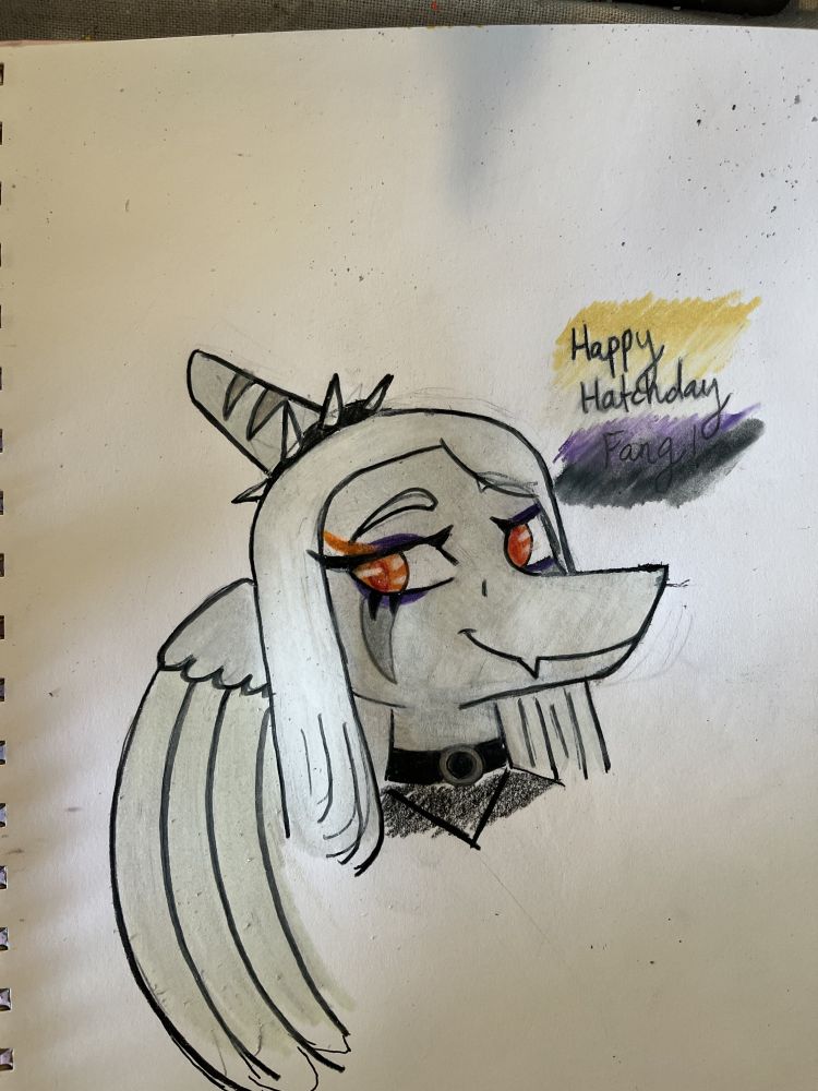 Traditional art, headshot of Fang from Goodbye Volcano High. To the right of their head, 'Happy Hatchday Fang!' is written in cursive, atop the colours of the nonbinary flag.