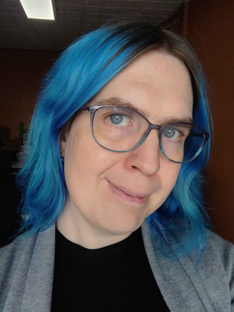 Far happier looking 37 year old, also with blue hair