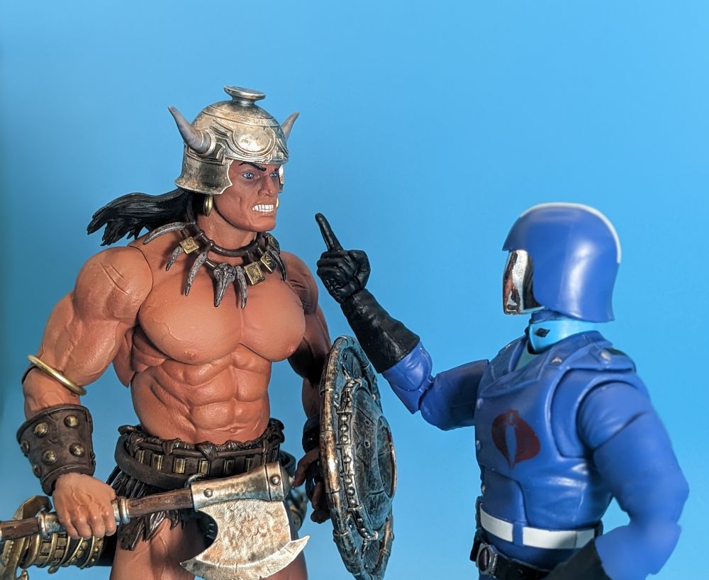 Cobra Commander gets his finger all in the face of Conan the Barbarian Gi Joe Classified and Frazetta Girls made the figures