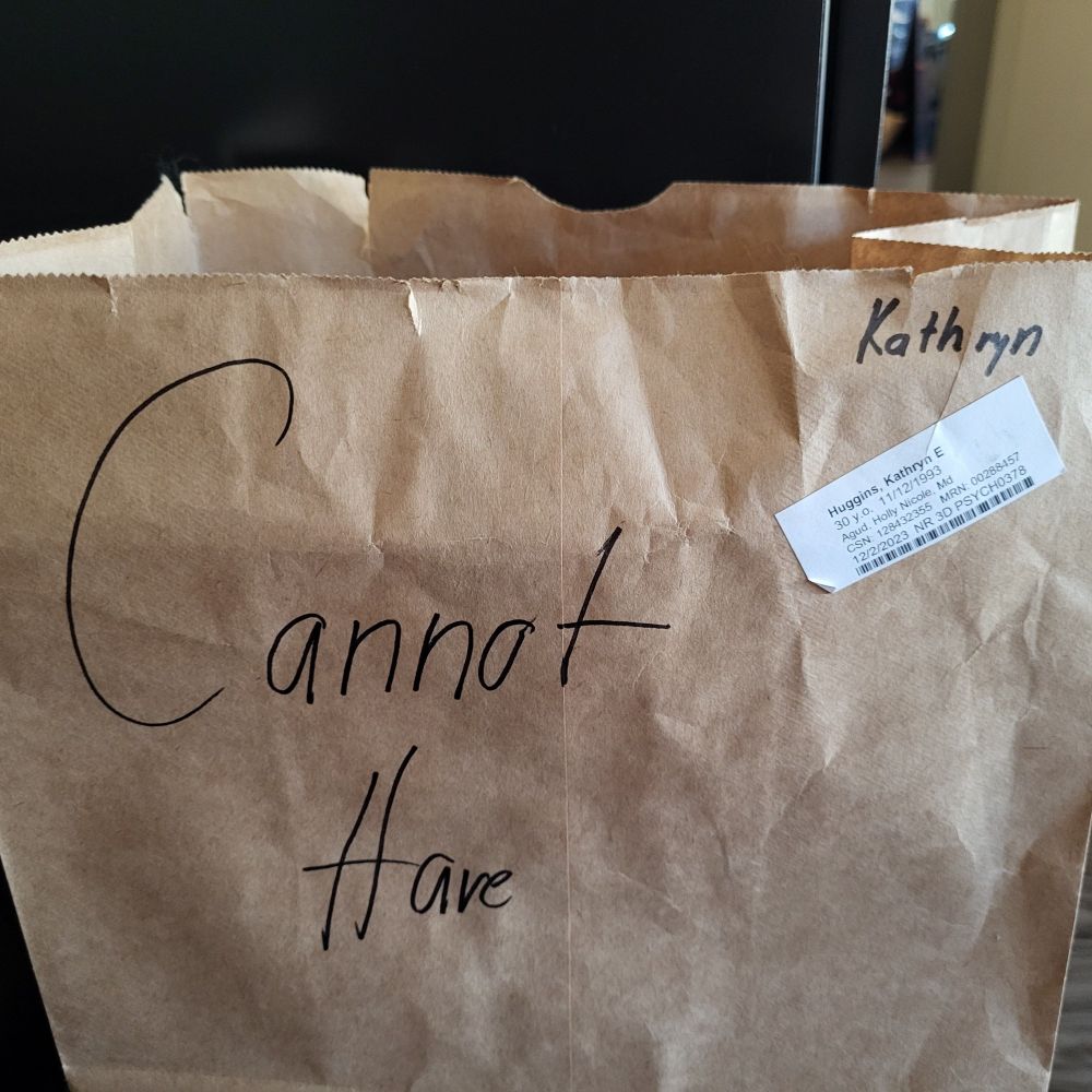 https://music.youtube.com/watch?v=spKRdILp-sE&si=PpYkv_nIVfqj22Ax

Brown paper sack, grocery sized

Top right reads "Kathryn"

Gender left says "CANNOT HAVE"

REDACTED medica information. Ask someone who might know what it says.

^_^