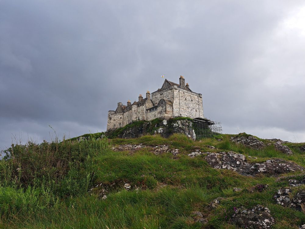 Duart Castle up on it's cliff, underneath a grey sky