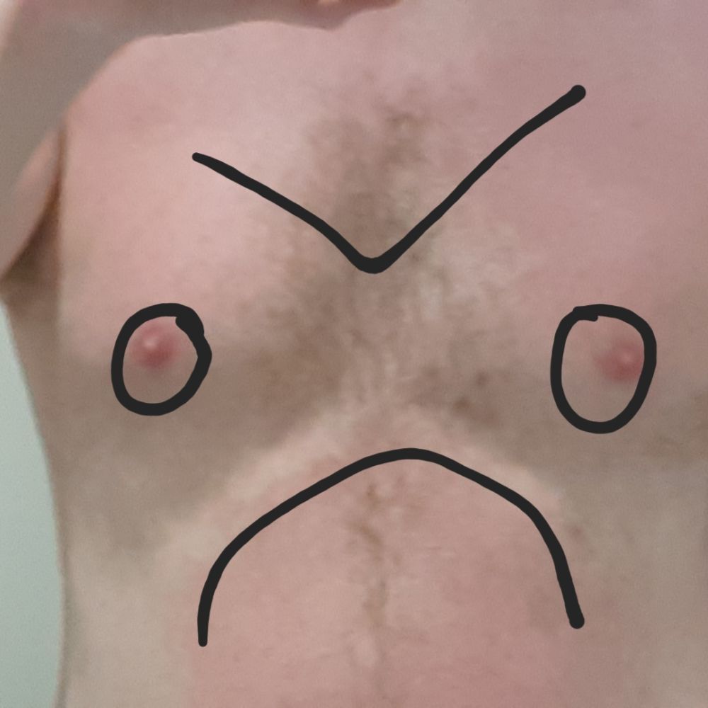 A naked male torso but I've drawn a grumpy face on it