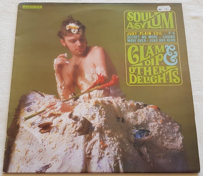 The Soul Asylum record, "Clam Dip & Other Delights" on a white table