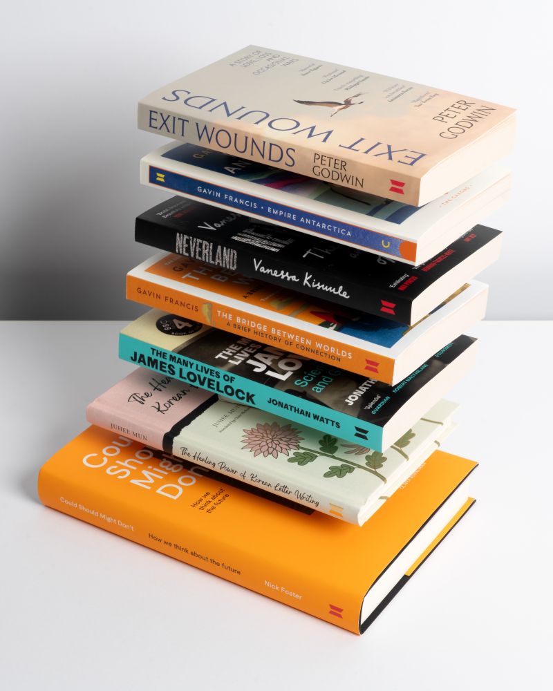 A stack of books published today, floating against a grey background