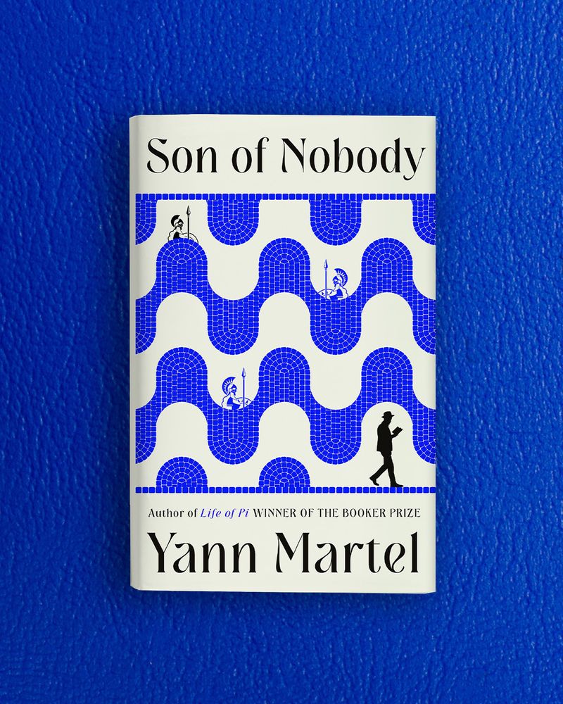 The cover of Son of Nobody, the new novel from Yann Martel, against a blue leathery background