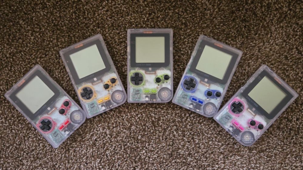 Modified Clear Gameboy Pockets with unique silicone pads of varying colors to highlight the buttons.