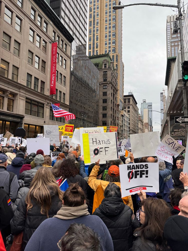 Handsoff protest in NYC. Thousands of people holding signs, shouting slogans  to keep this admin honest. 
