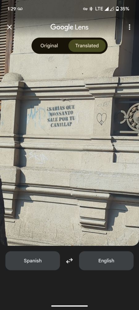 Graffiti translates to: Did you know that Monsanto comes out of your tap?
