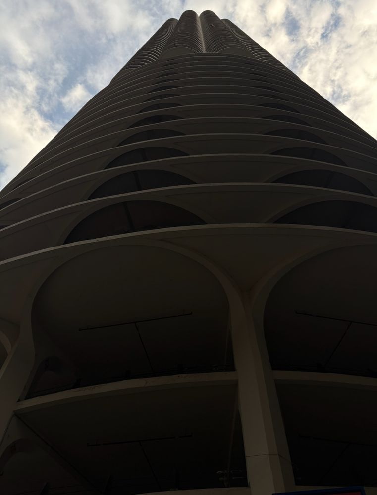 Marina city tower in Chicago, it looks like a tall honeycomb, with parking below and apartments above. https://en.m.wikipedia.org/wiki/Marina_City,
Featured on Wilco’s 2002 album Yankee Hotel Foxtrot 