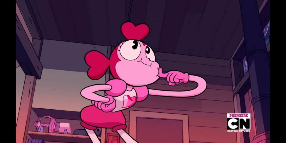Spinel from Steven Universe Future smiling while in an exaggerated pose while poking her cheek with her left hand and her right arm on her hip