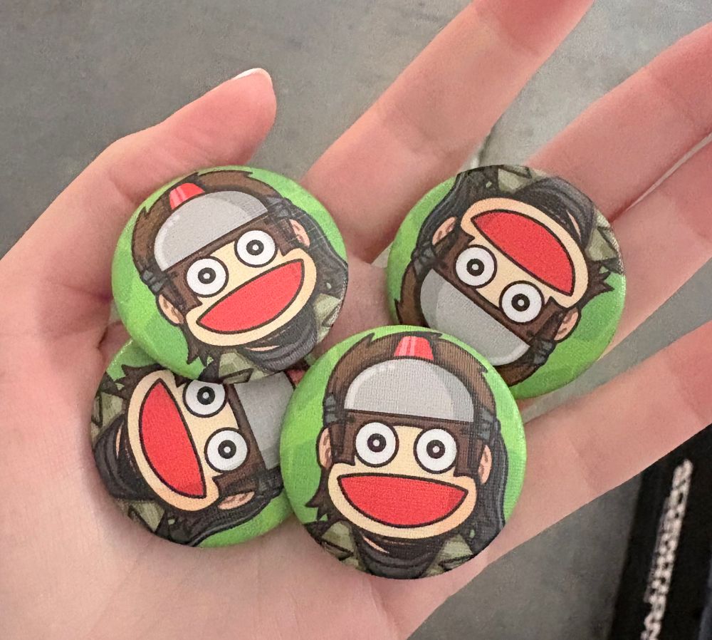 buttons featuring naked snake in a pipo monkey mask