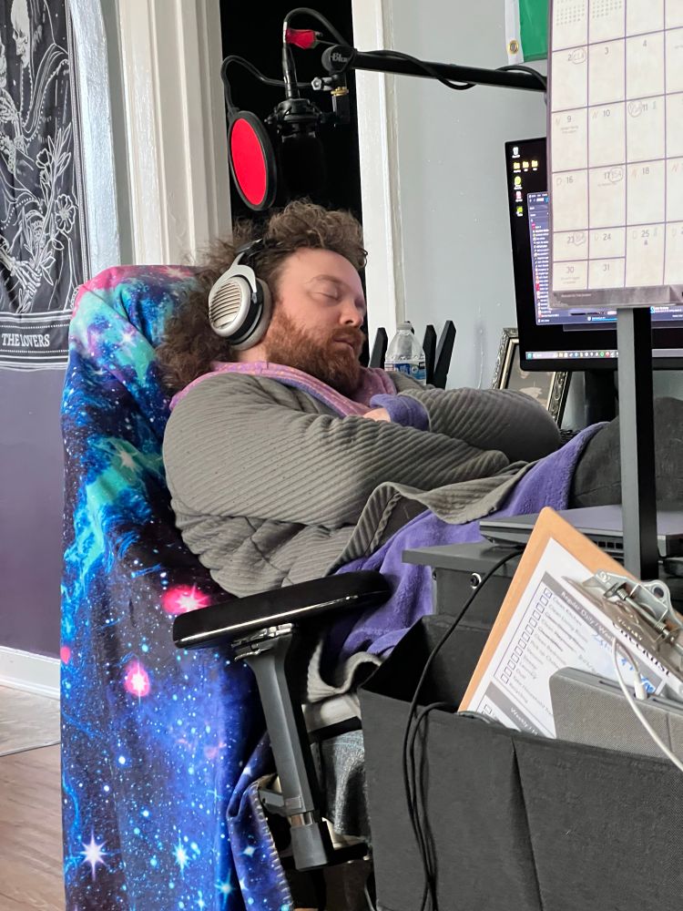 Max asleep at computer desk