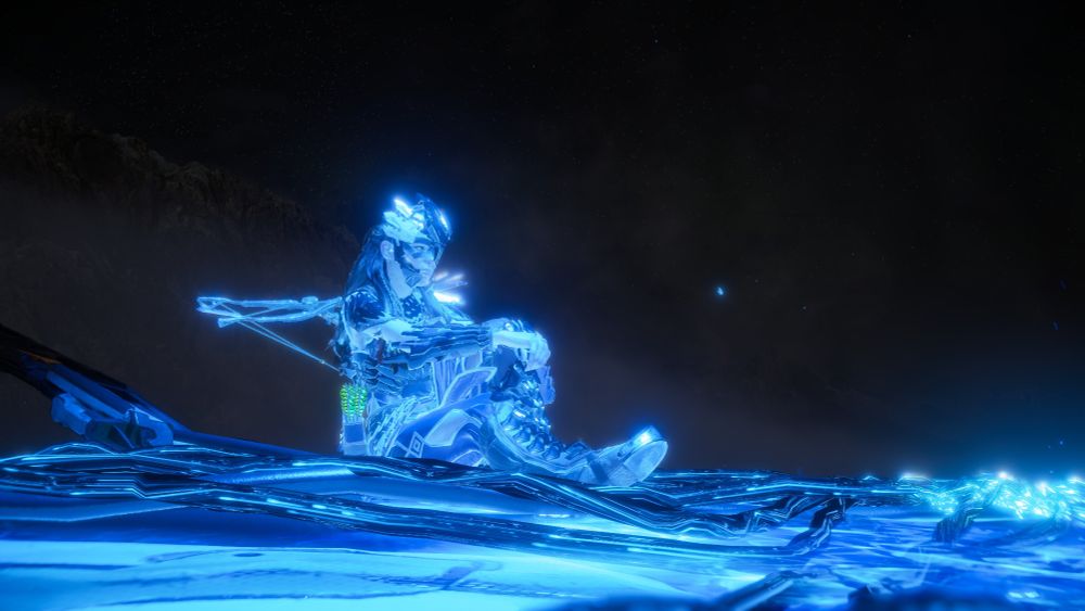 Aloy sitting down amidst the glowing blue.Aloy sitting down amidst the glowing blue.
