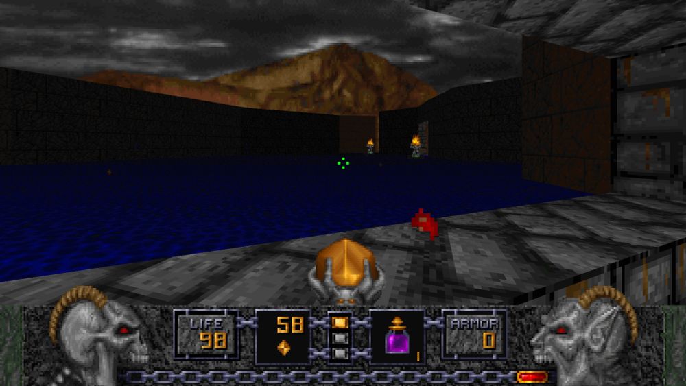 Standing on cobblestone, surrounded by water and holding a wand with a yellow crystal. In the far away distance is a mountain.
