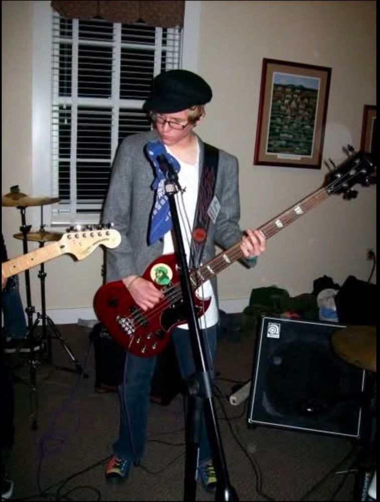 A young Warren plays bass with Mrs. Pepper at a NYE battle of the bands many moons ago