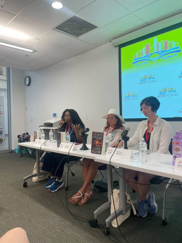 Me, Jennifer K Lambert, and Ehigbor Okosun sitting on a panel in one of the library rooms at Columbus Book Fair