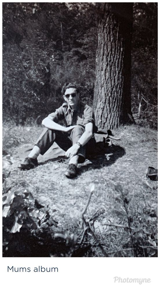 B & W photo of Soldier sitting under a tree