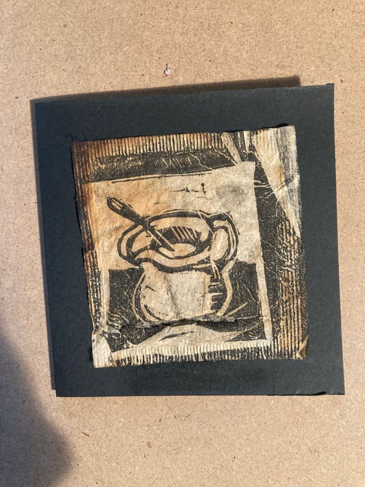A small Lino print featuring a jug printed onto a used teabag