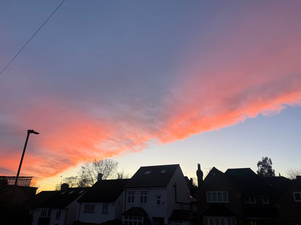 Pinky sky and houses, not mine. 