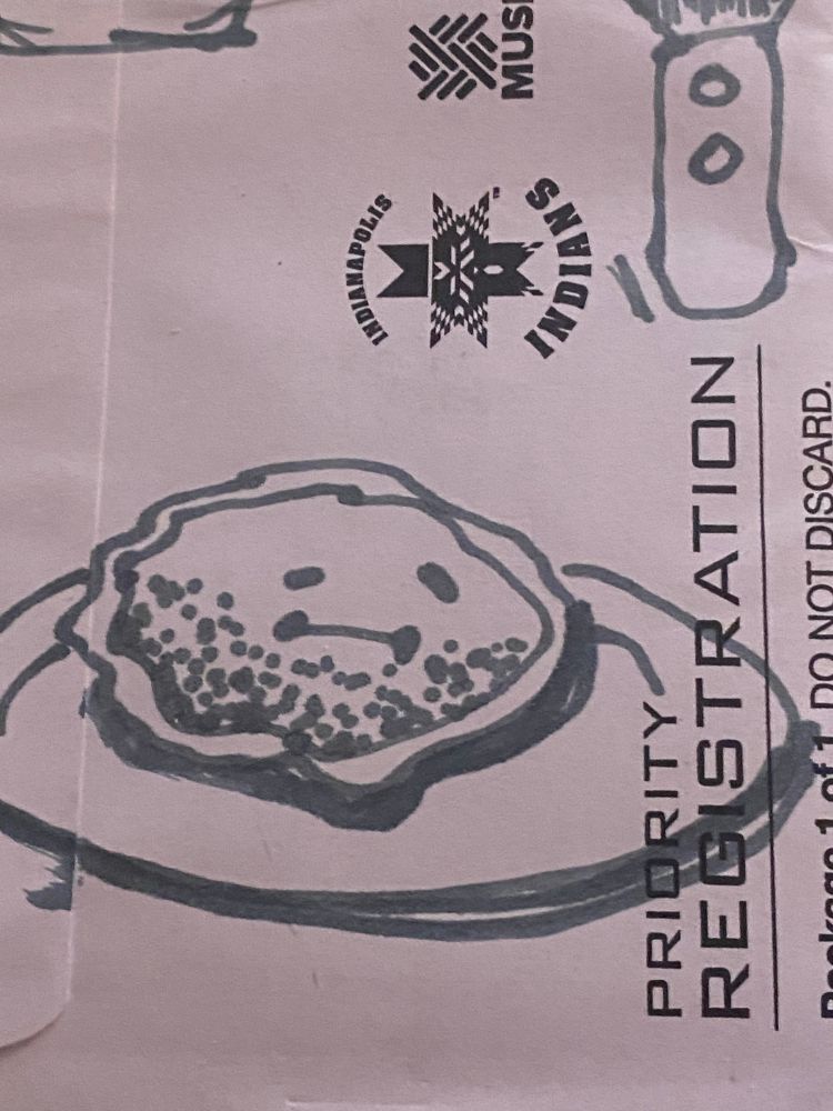 Close up of the bottom of the envelope, with text that says "Priority Registration" and a logo for the Indianapolis Indians baseball team (gross). This screenshot features a slumped pancake on a plate with lopsided eyes and an awkward looking close lipped smile