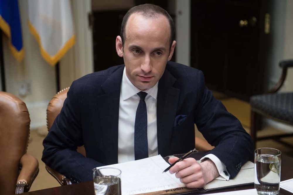 Stephen Miller writing with his left hand.