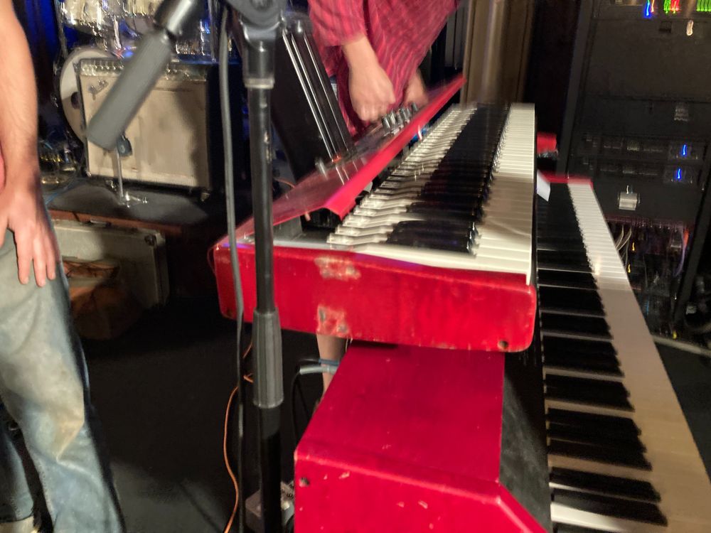 Very expensive musical keyboard with its parts all open.