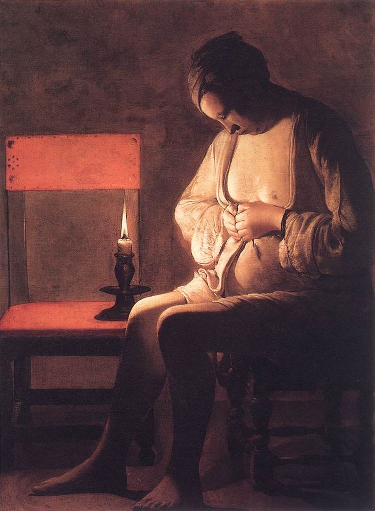A woman crushing a flea in a candle-lit room