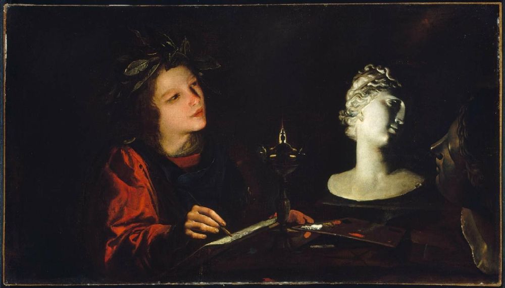 A young artist wearing a laurel crown draws from ancient heads, dramatically illuminated by an oil lamp