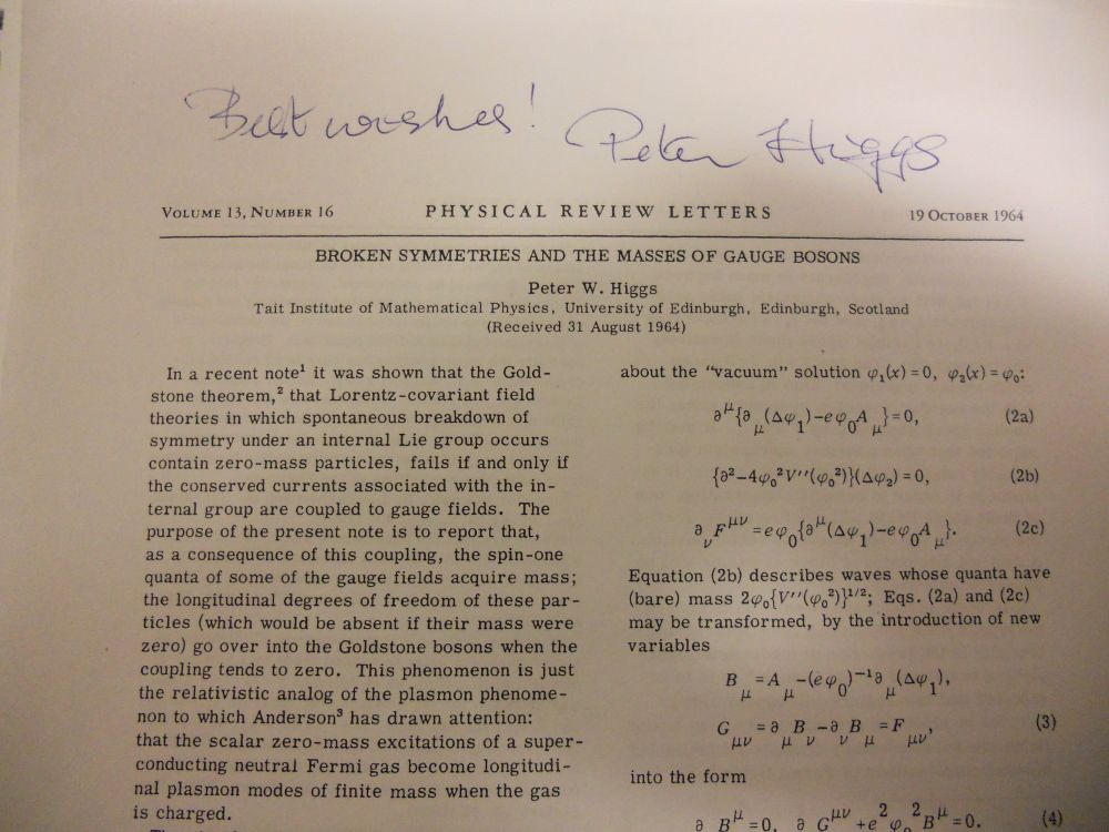 First page of "Broken Symmetries and the Masses of Gauge Bosons" authored by Peter W. Higgs in Physical Review Letters in 1964. Signed Best Wishes! Peter Higgs