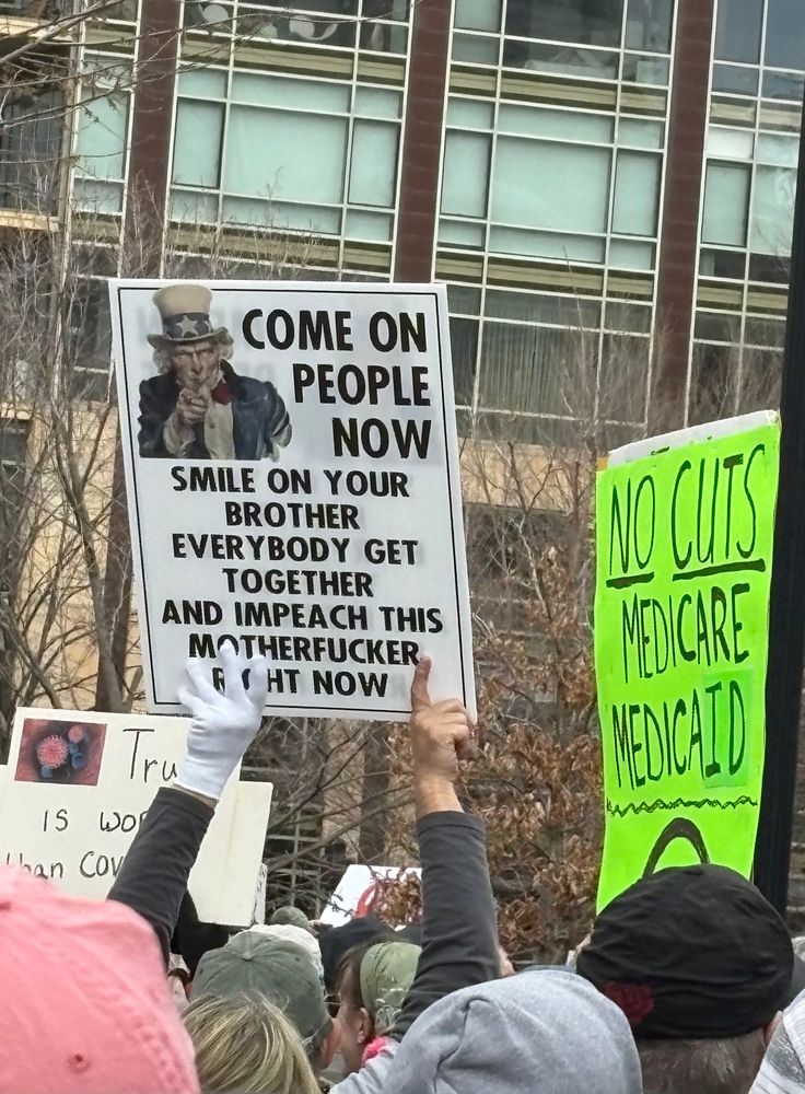 Sign of Uncle Sam with text: “ Come on people now, smile on your brother, everybody get together and impeach this motherflucker right now”