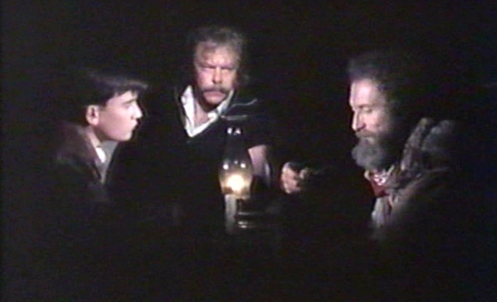 The characters Troy McGregor, Zap Rowsdower and Mike Pipper are seen in a dark room, illuminated by oil lamp, in the hit 1990 film The Final Sacrifice.
