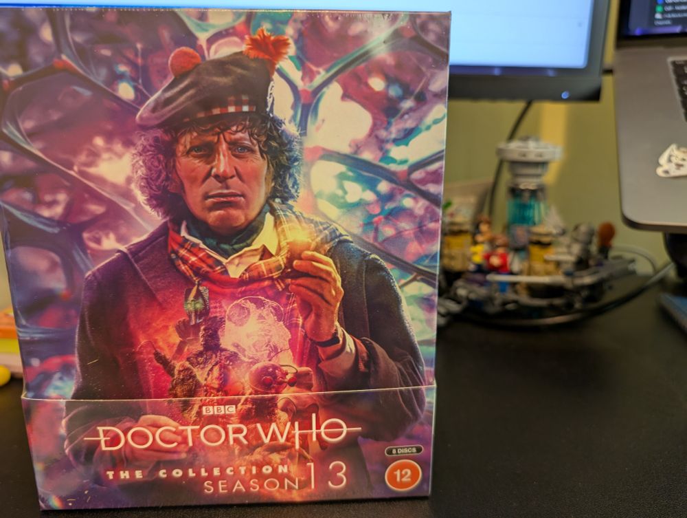 Doctor Who The Collection Season 13, newly arrived in plastic beside an out of focus Lego TARDIS interior.