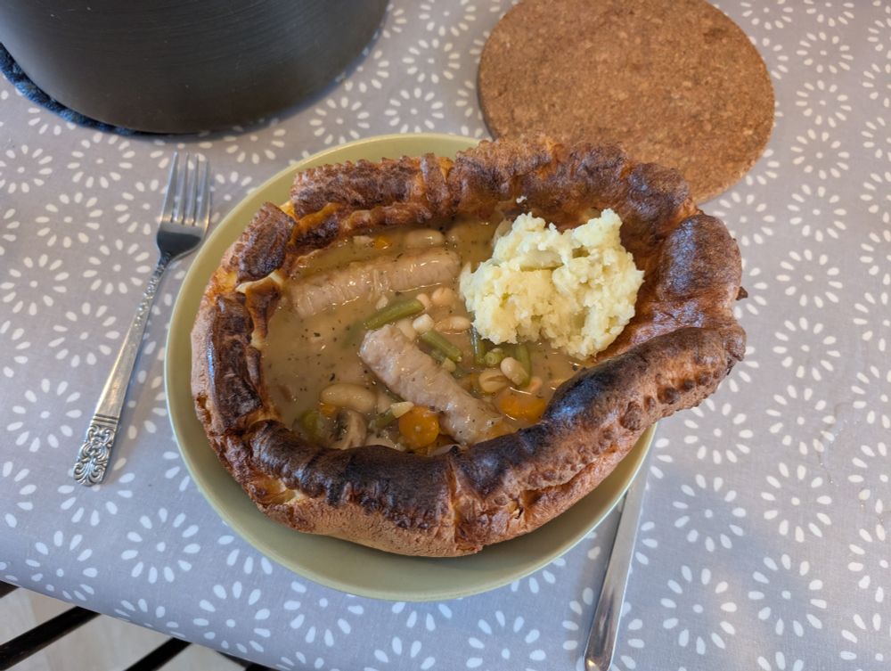 Home-made Giant Yorkshire pudding attempts to expand beyond the bowl intended to contain it.