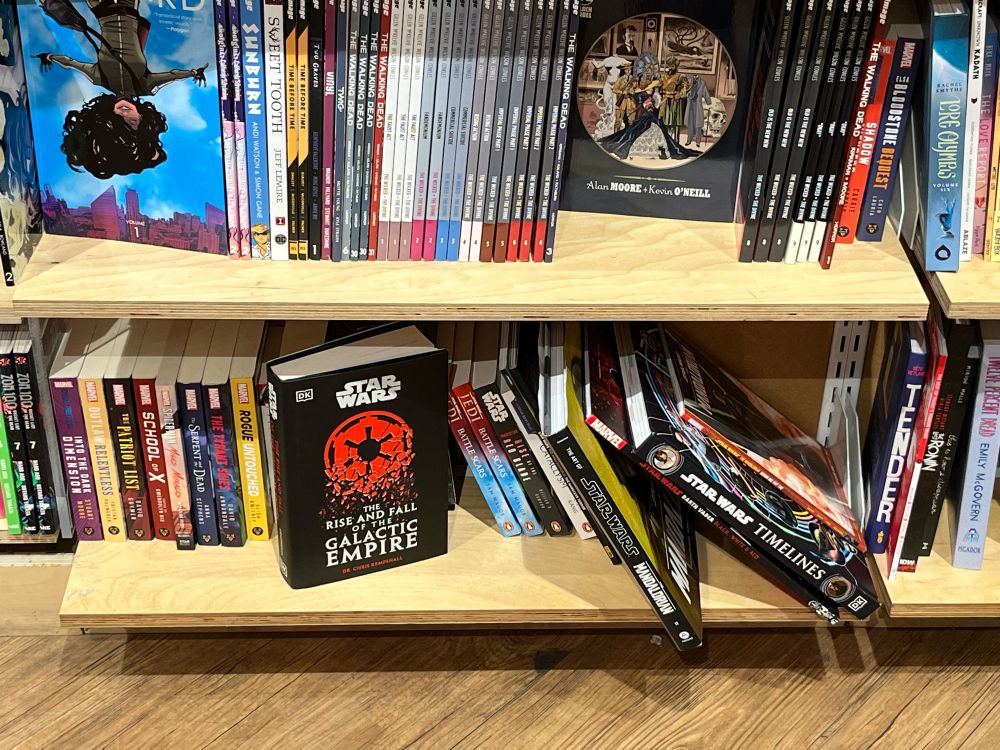 The book ‘The Rise and Fall of the Galactic Empire’ on a bookstore shelf with lots of other books