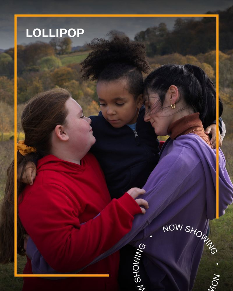 A woman hugs two little girls in a field. Text - Lollipop, Now Showing. 