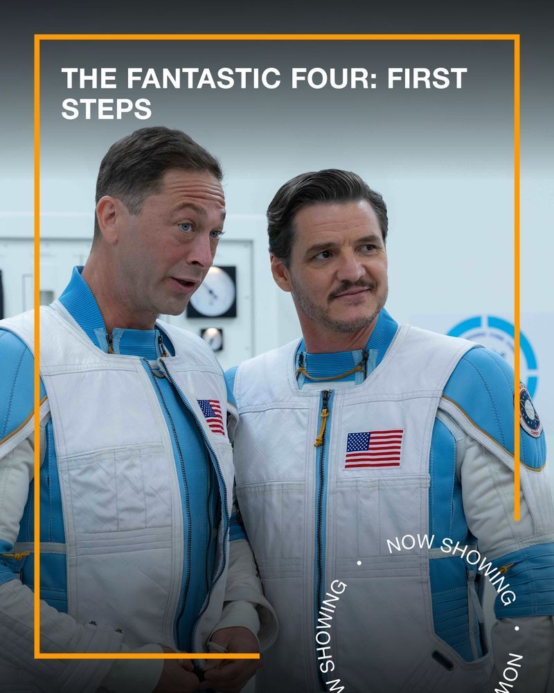 Two men wearing white and blue space suits stand next to each other smiling. Text - The Fantastic Four First Steps, Now Showing.