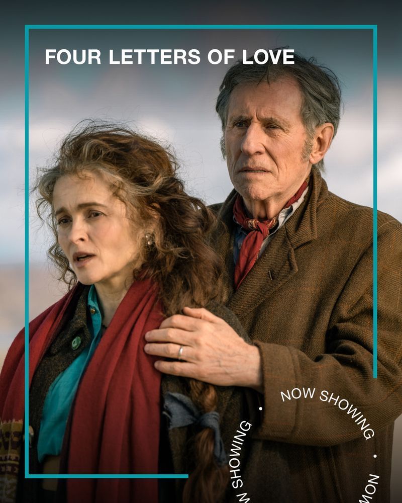 A middle-aged man and woman wearing coats and scarves stand on a beach together. Text - Four Letters of Love, Now Showing.