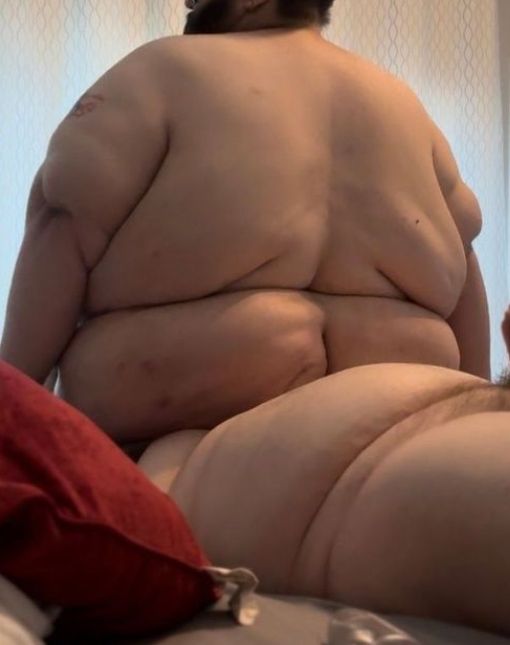 Big fat man sits on a less big fat man's face