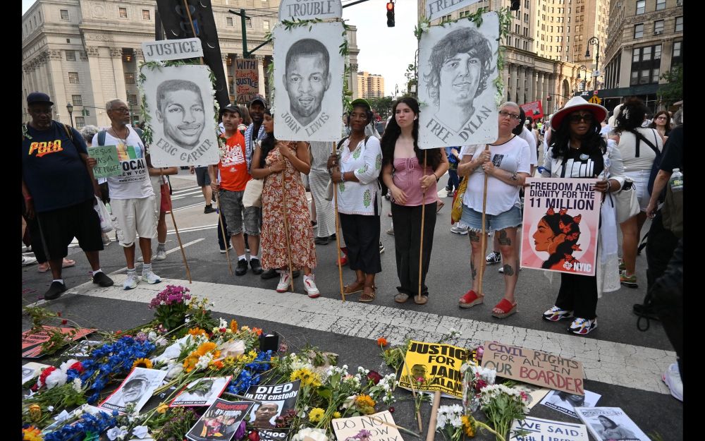 Flowers and photos left at the end of the Good Trouble March yesterday as a memorial for those who died in ICE detention. 